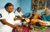 Grama vastavya: Minister Anjaneya has dinner at Marli Koraga�s house in Murur village